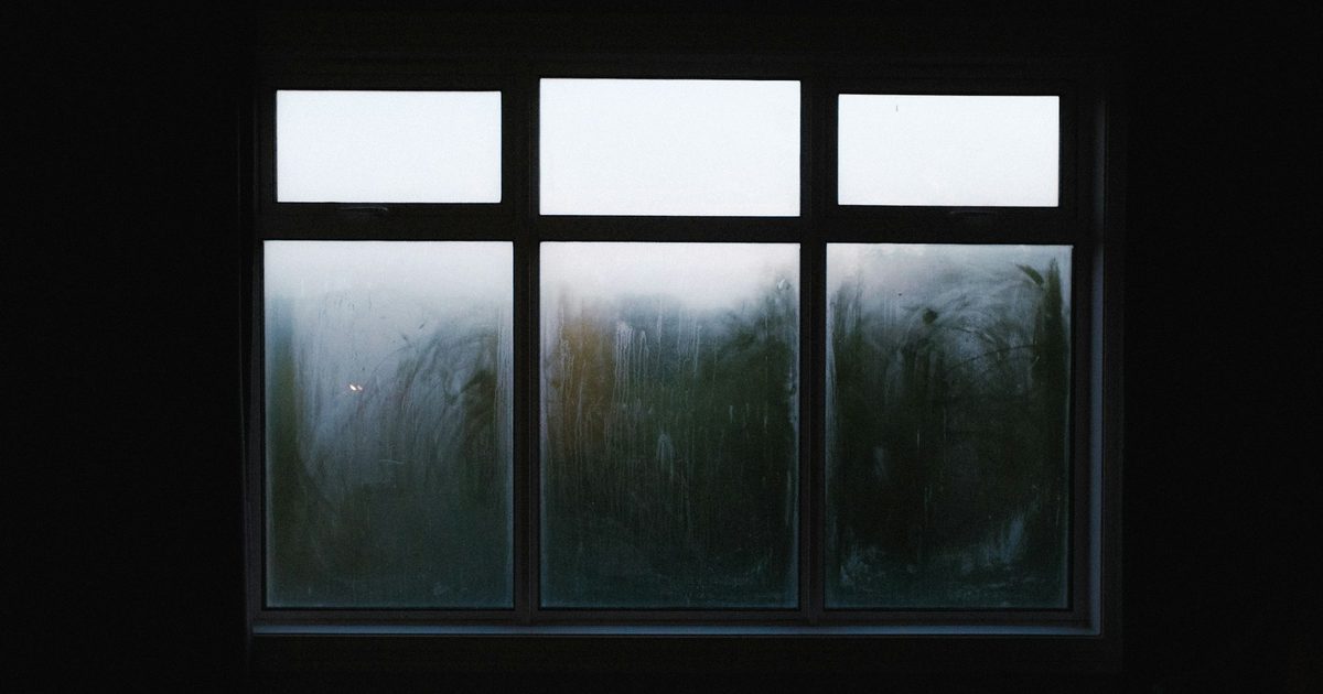 Heavy condensation on the inside of a window, a sign of indoor damp